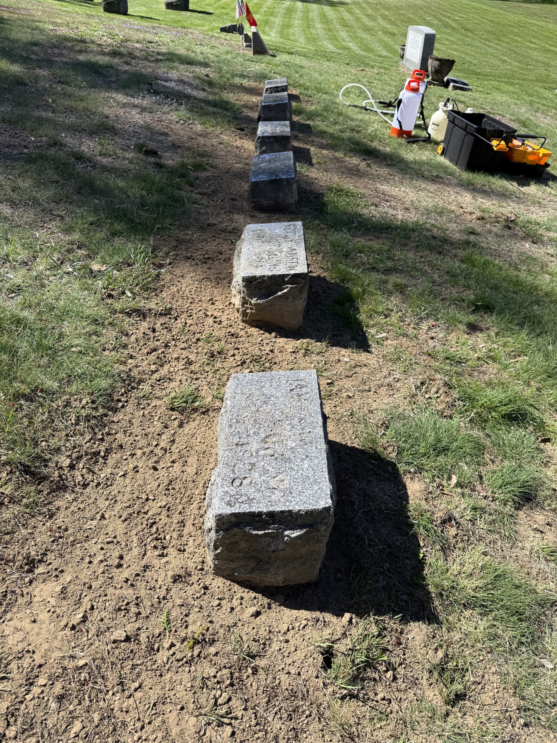 Sparling family plot leveled and reset before gravestone cleaning