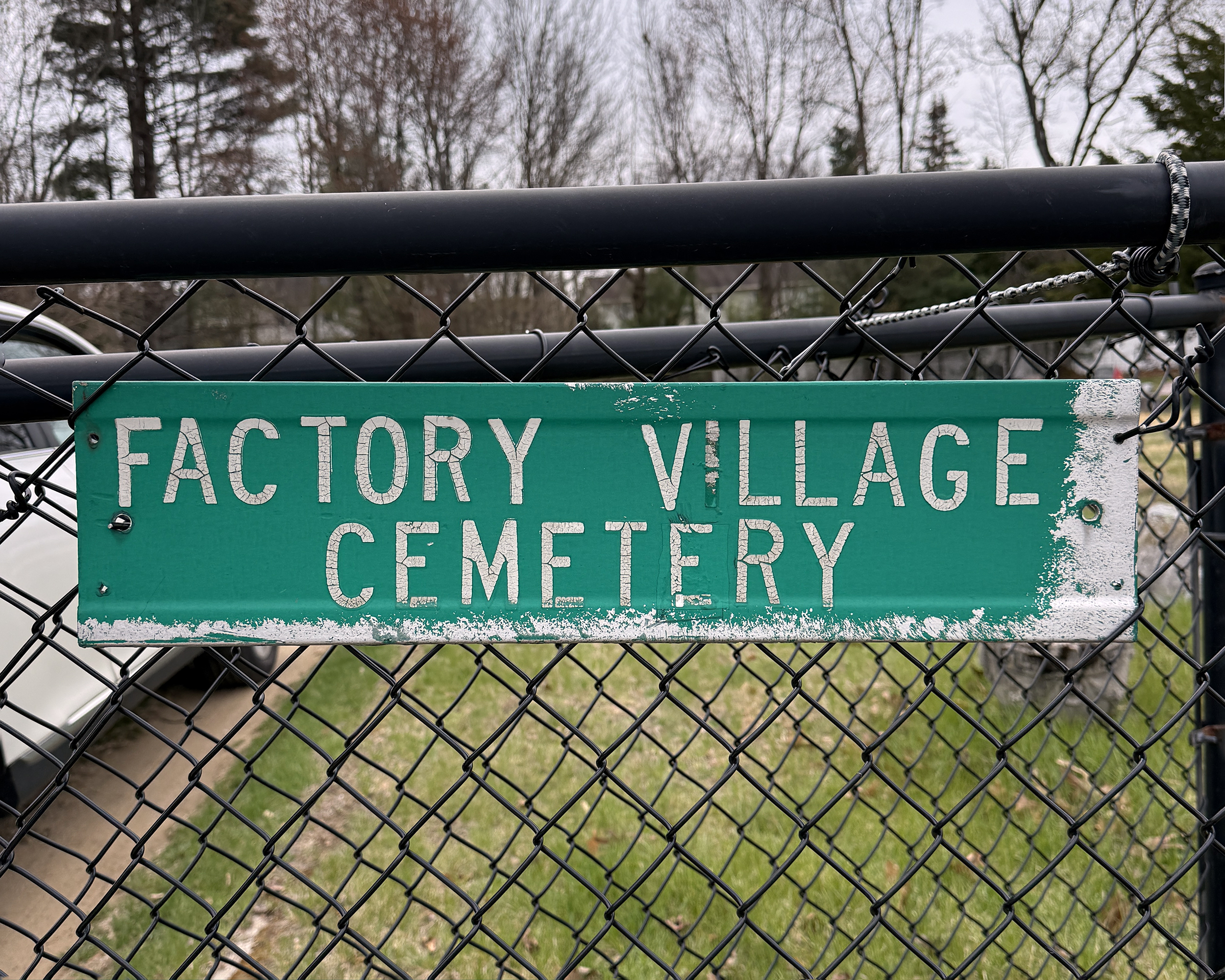 Factory Village Cemetery Sign on Chain-Linked Fence in Milton, New York.