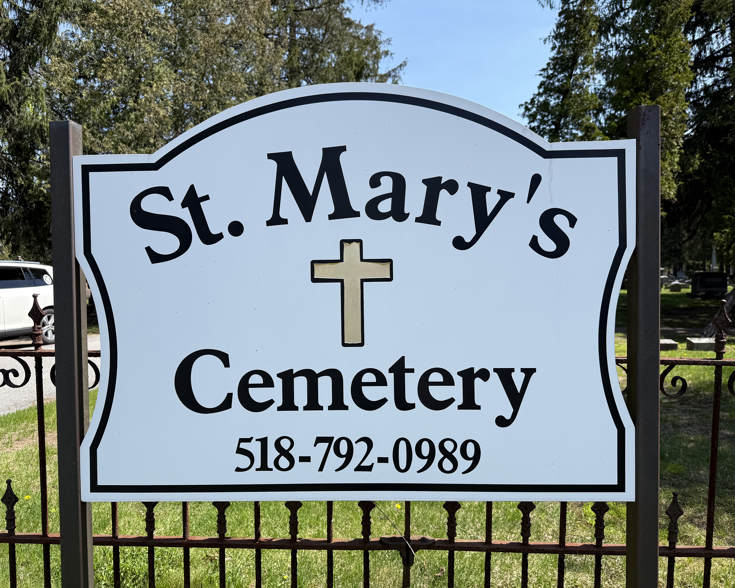 St. Mary’s Cemetery Entrance Sign with Cross and Phone Number in South Glens Falls, New York.
