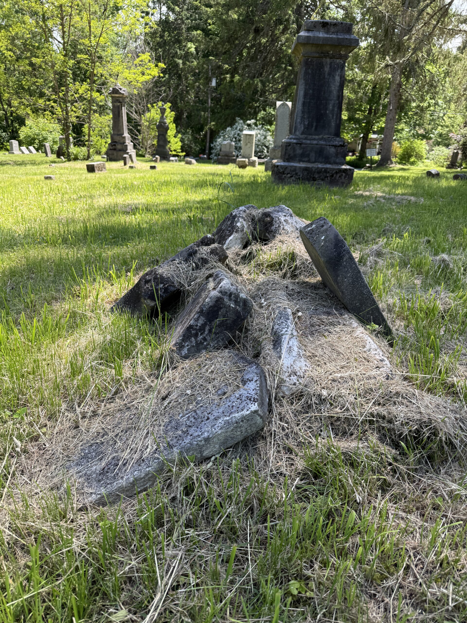 Broken headstone fragments documented during cemetery condition reporting