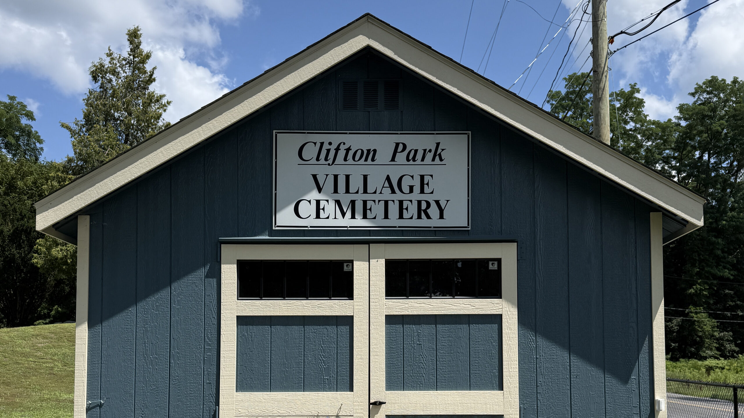 Clifton Park Village Cemetery entrance sign on the cemetery building in Clifton Park, New York