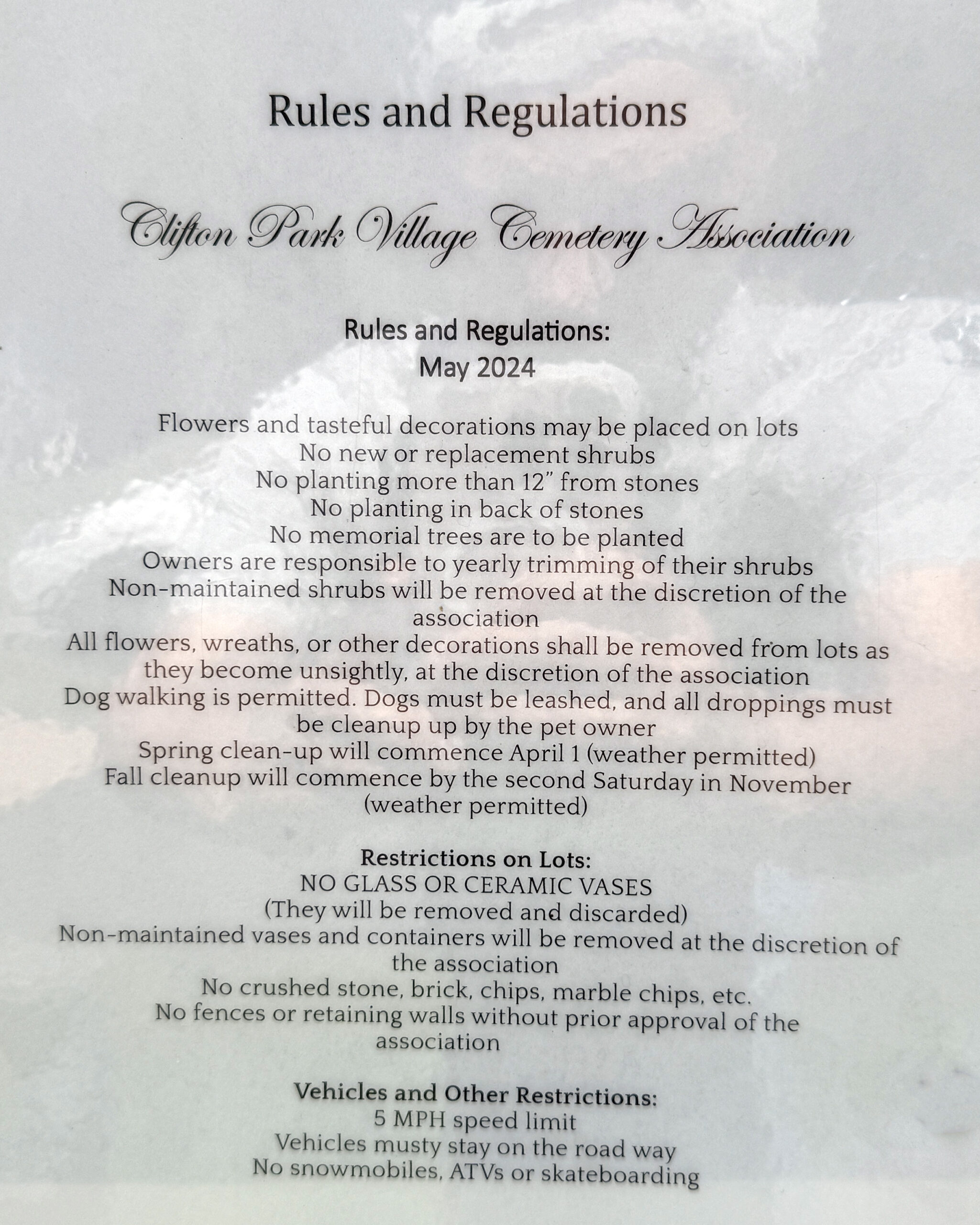 Clifton Park Village Cemetery rules and regulations sign showing cemetery decoration and maintenance policies
