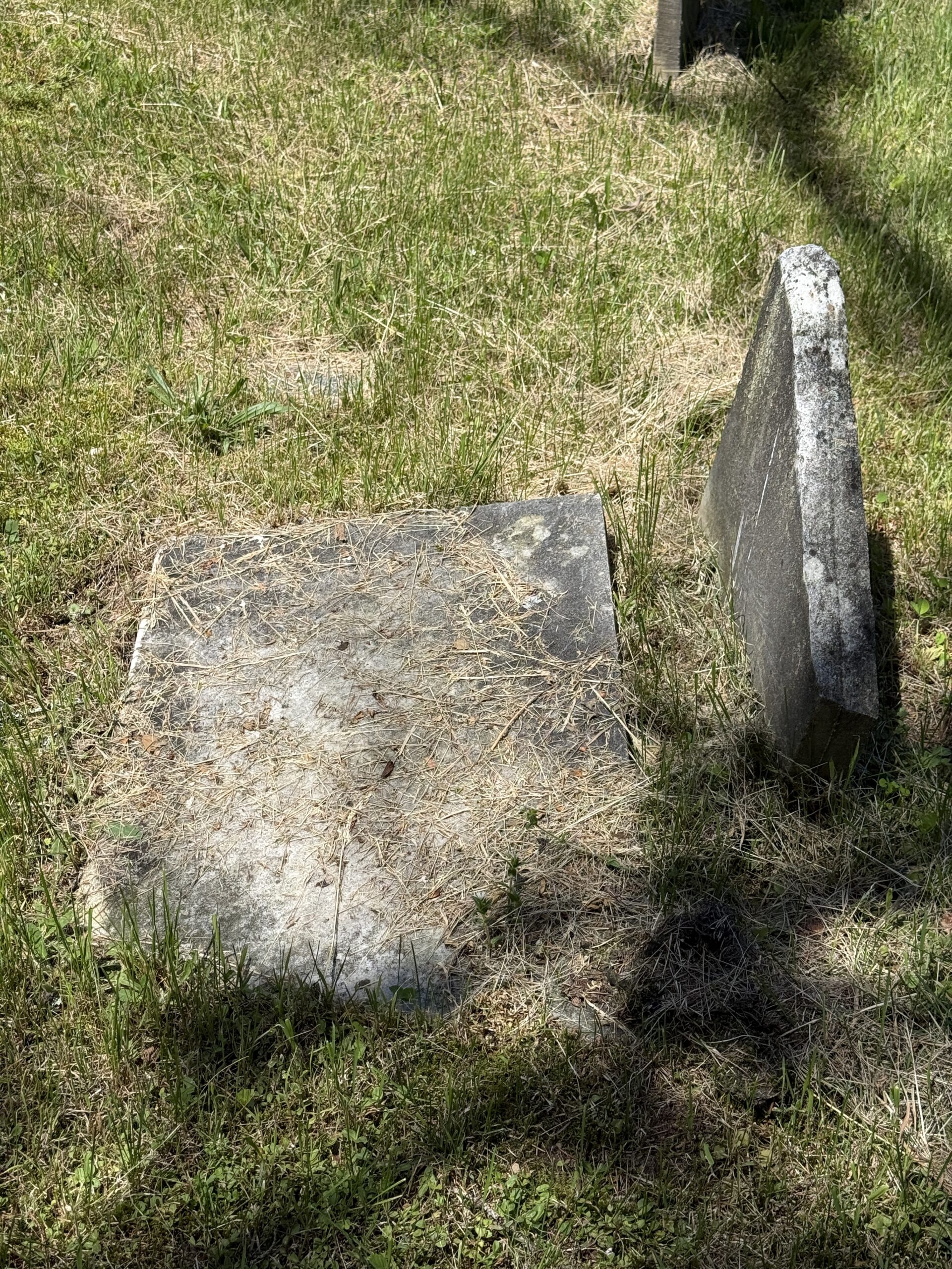Displaced headstone pieces documented during cemetery condition report