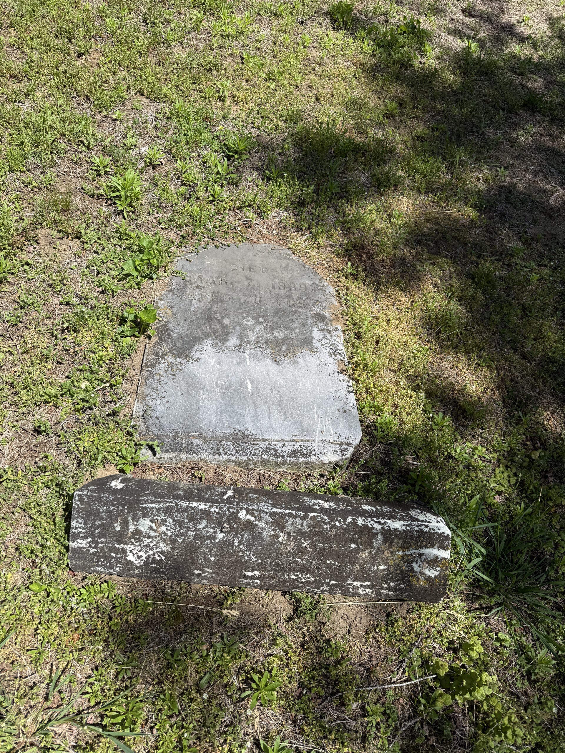 Fallen grave marker documented during cemetery condition report