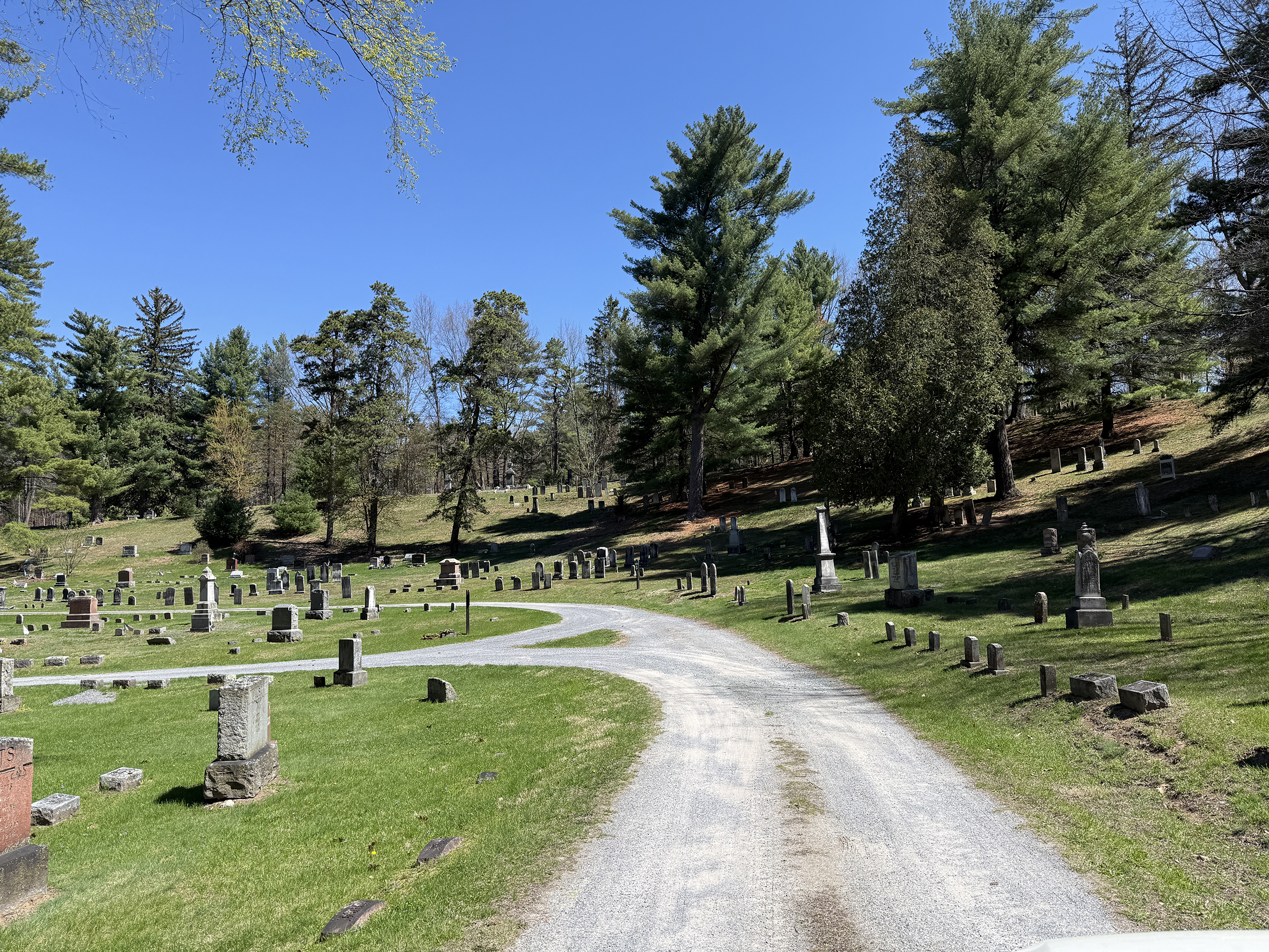 Landscape view of Jonesville Cemetery in Clifton Park New York with winding paths historic headstones and trees