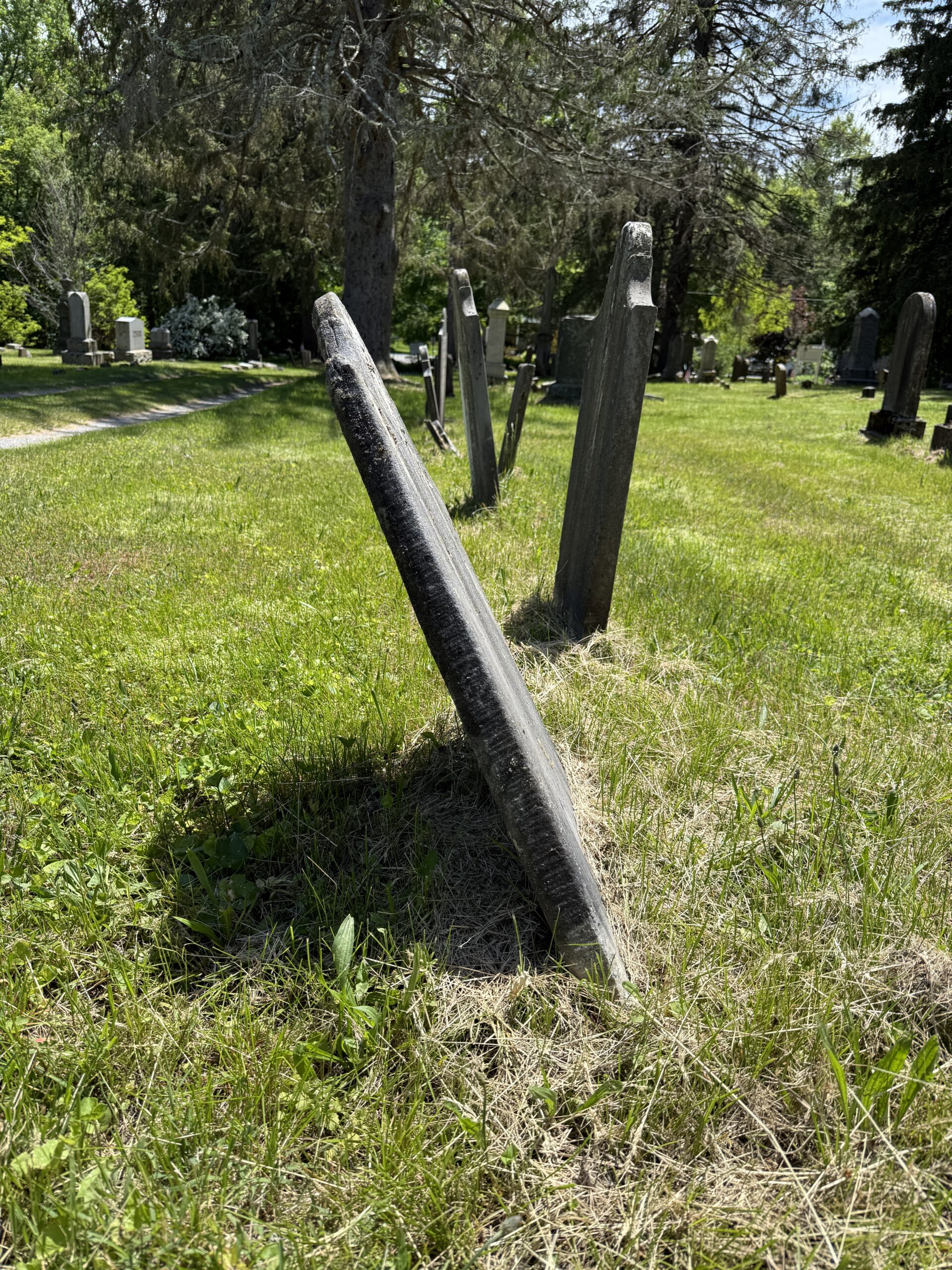 Leaning historic headstones documented during cemetery condition reporting