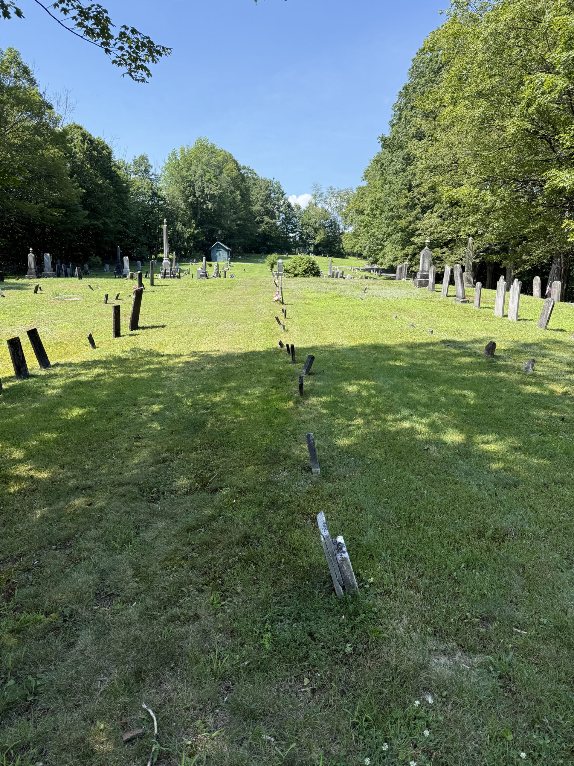 Leaning gravestones in Barkersville Cemetery in Providence New York showing cemetery settling and preservation concerns