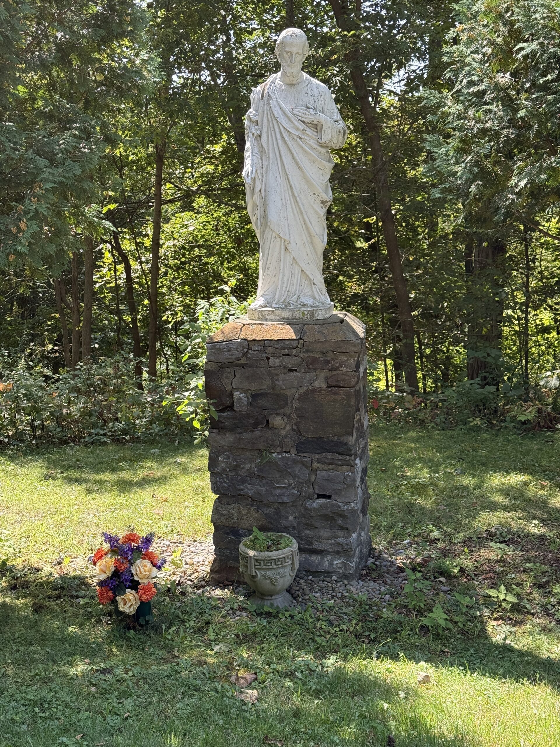 Roadway through Fairview Cemetery in Amsterdam New York with mature trees and historic memorials