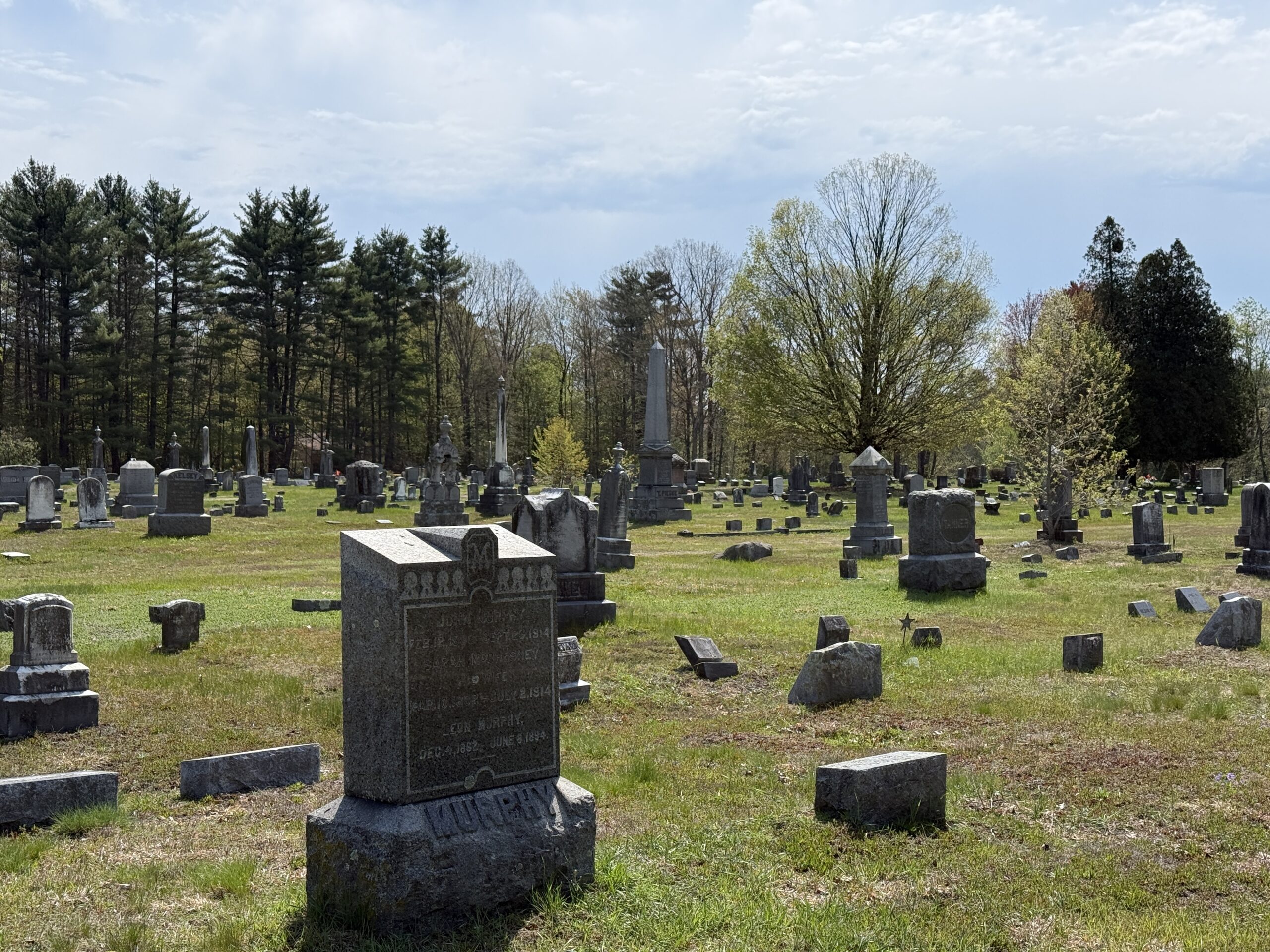 Landscape view of Gansevoort Cemetery in Wilton New York with historic gravestones and cemetery roadway