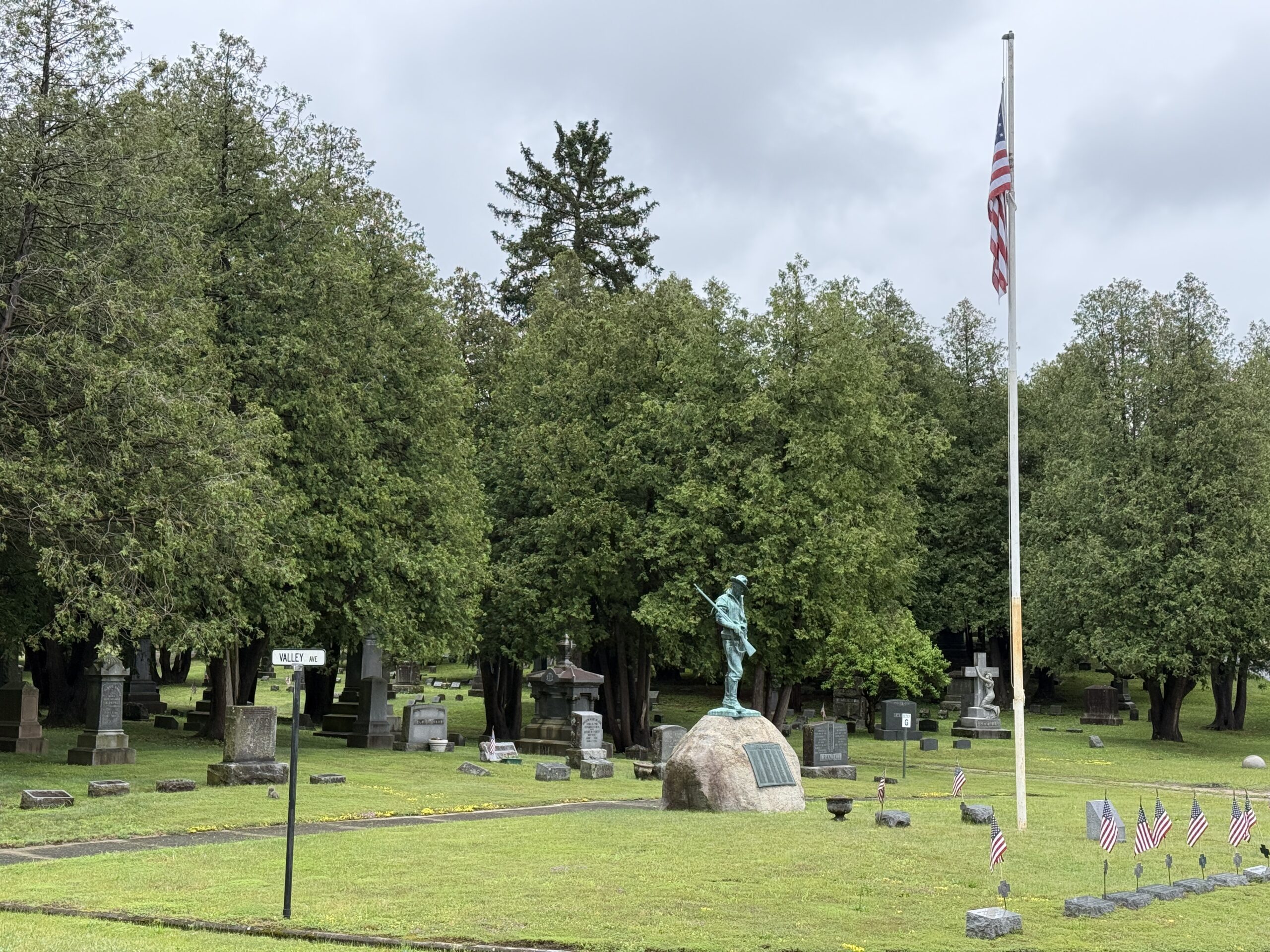 Veteran memorial area with flags at Greenridge Cemetery in Saratoga Springs New York