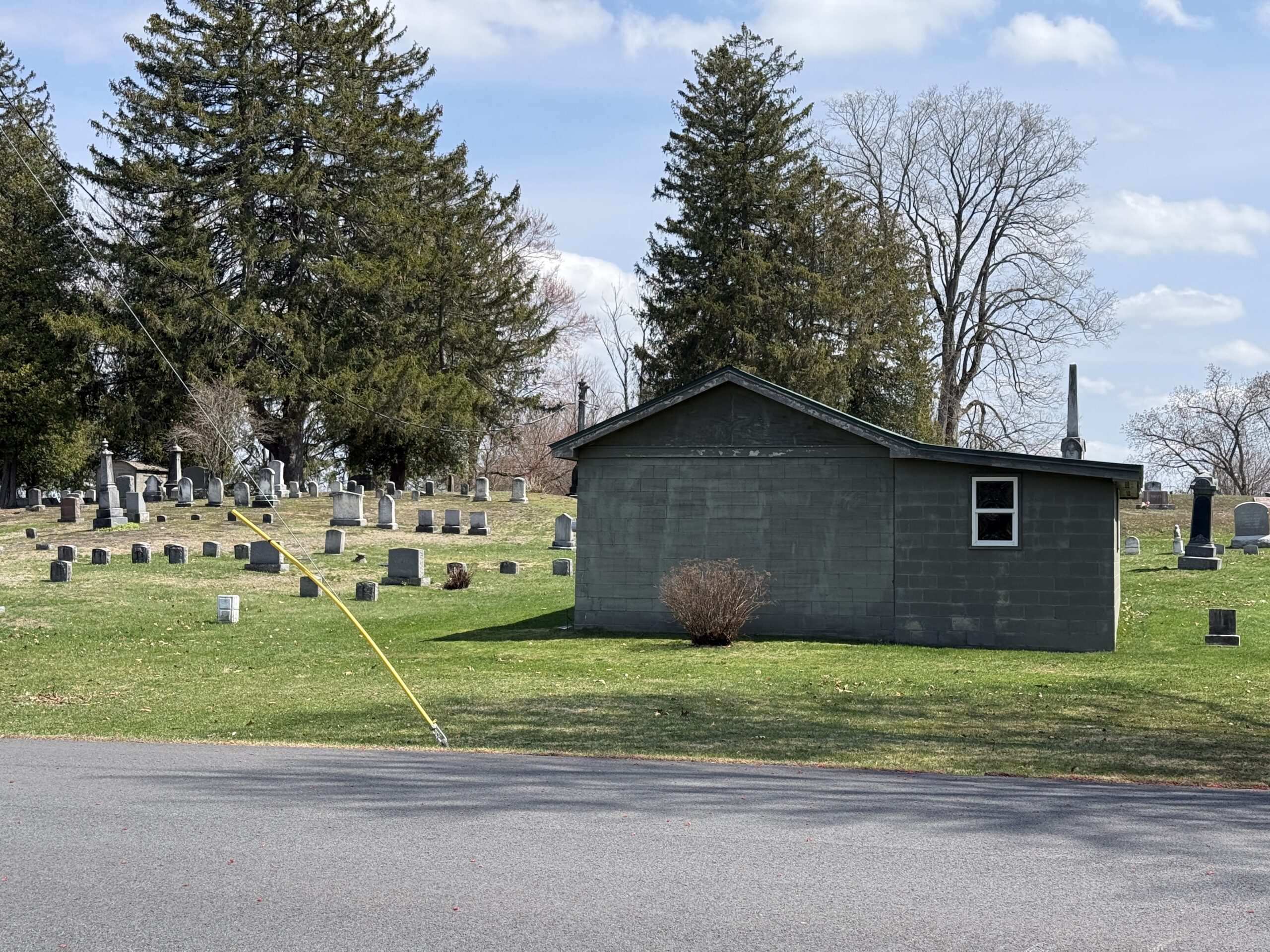 Maintenance building and historic cemetery sections at Prospect Hill Cemetery in Schuylerville New York