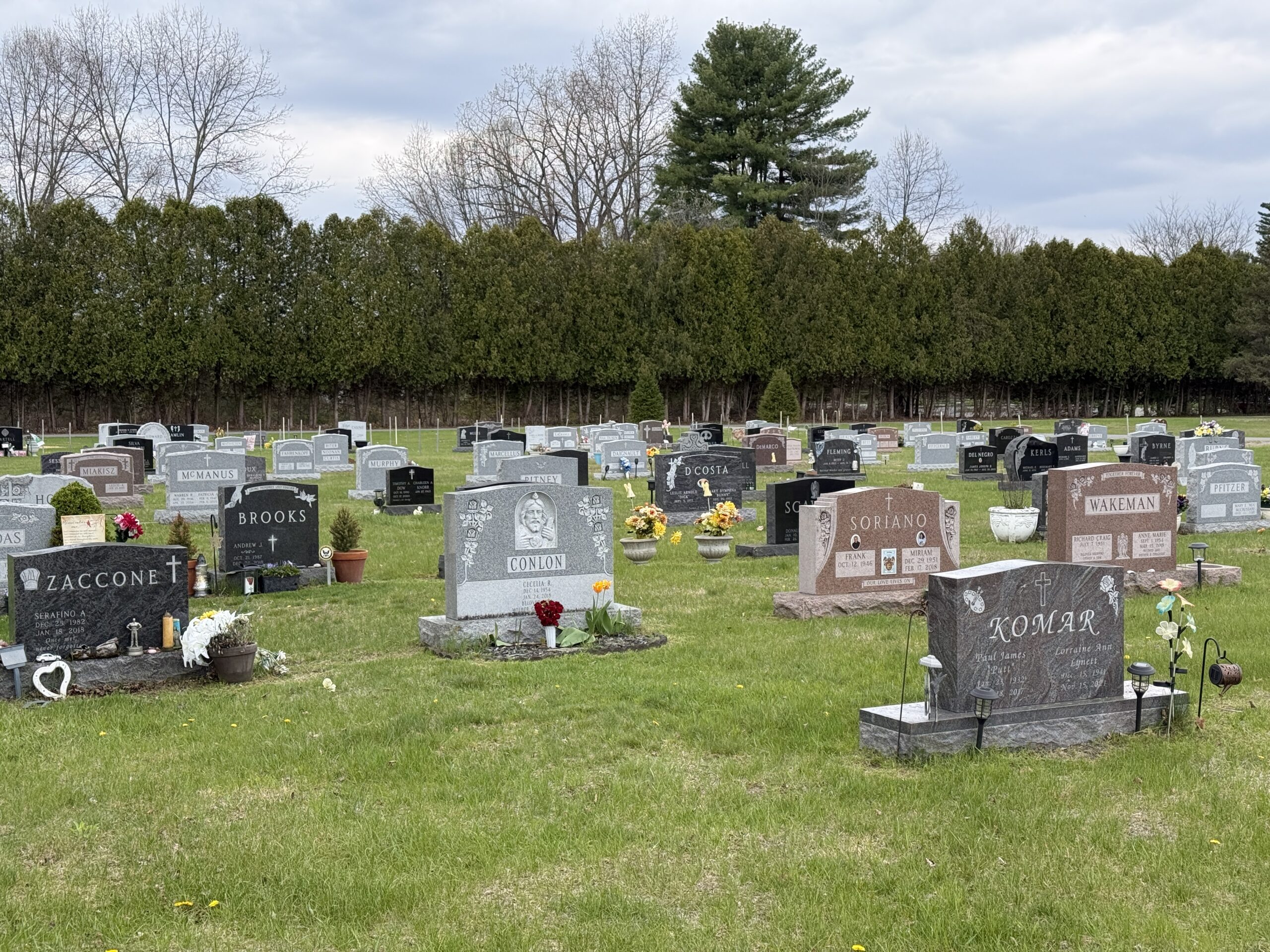 Family memorial section at St. Peter's Cemetery in Saratoga Springs New York showing modern granite monuments and family plots