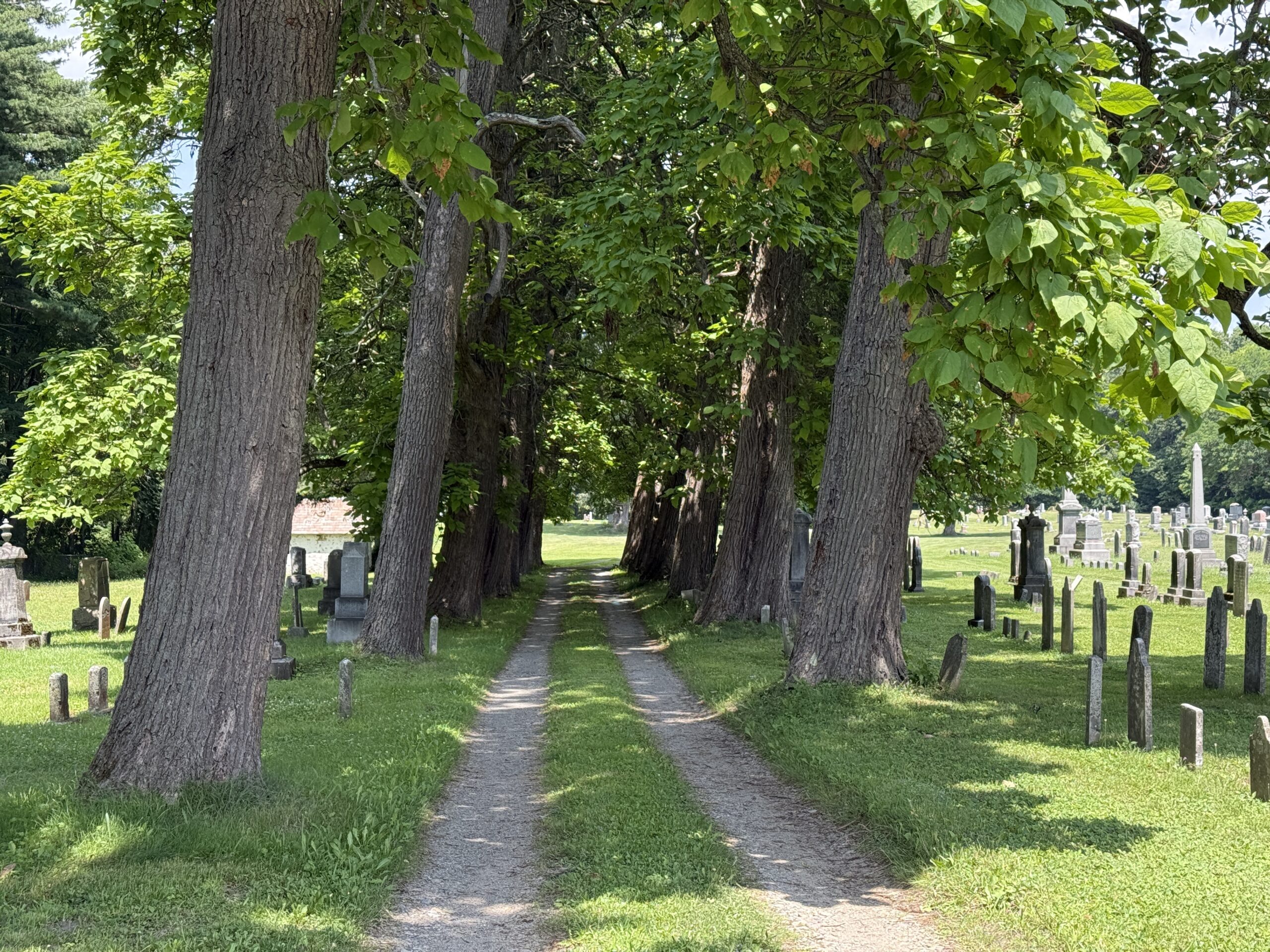 Roadway entrance and historic burial landscape at Clifton Park Baptist Cemetery in Clifton Park New York