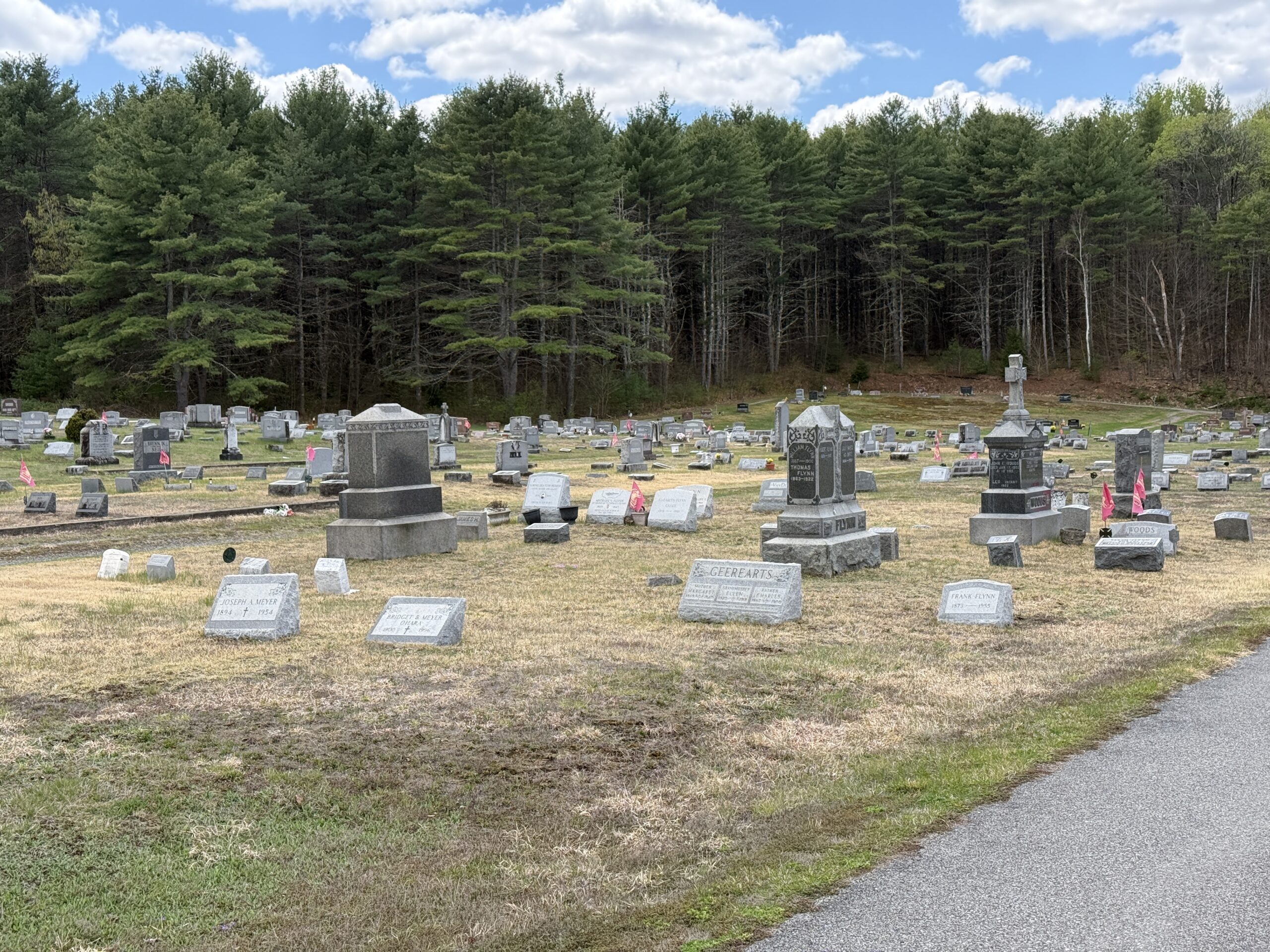 Headstones and family burial areas at Corinth Catholic Cemetery in Corinth New York