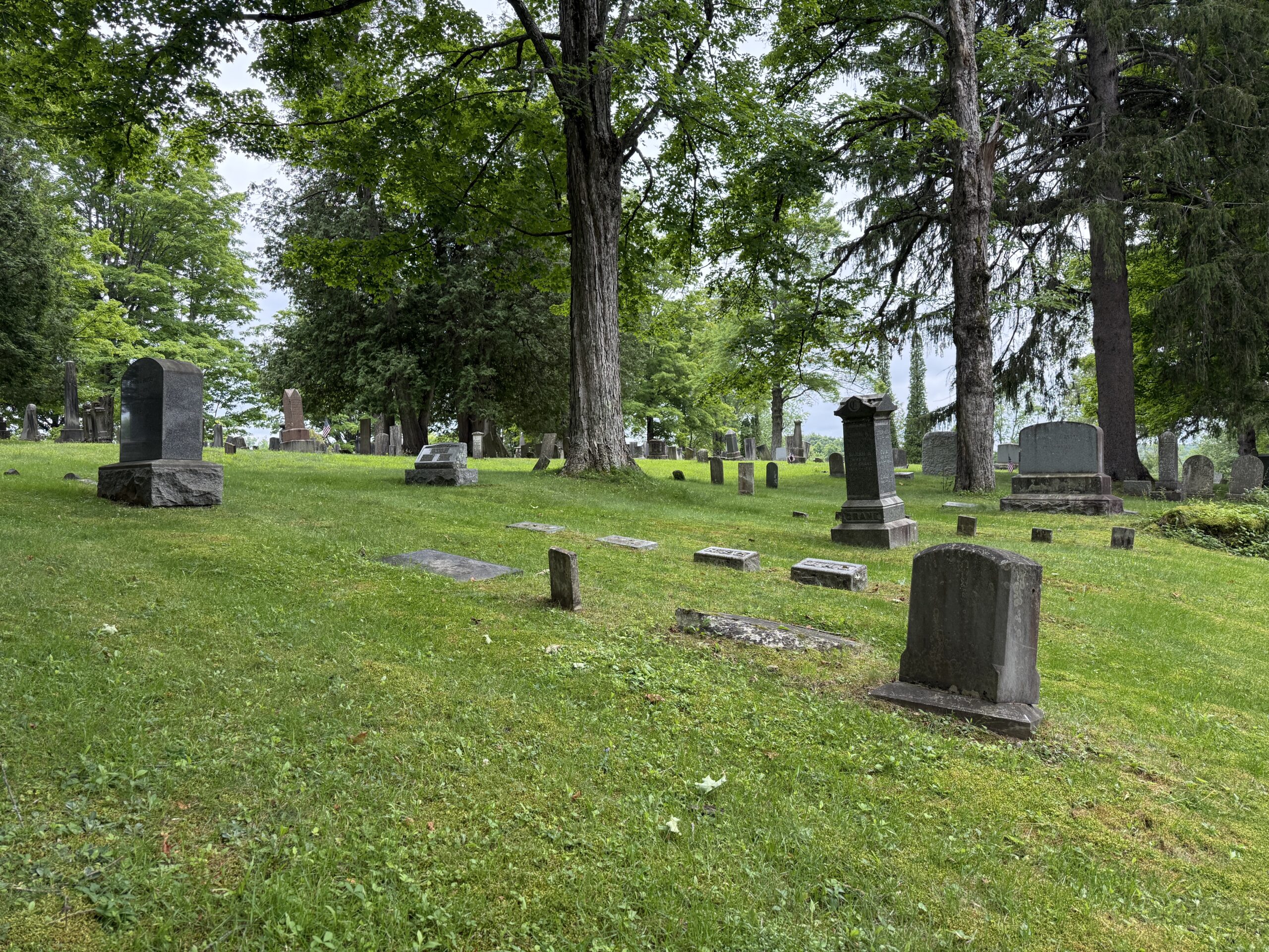 Historic headstones and family burial areas at Galway Village Cemetery in Galway New York