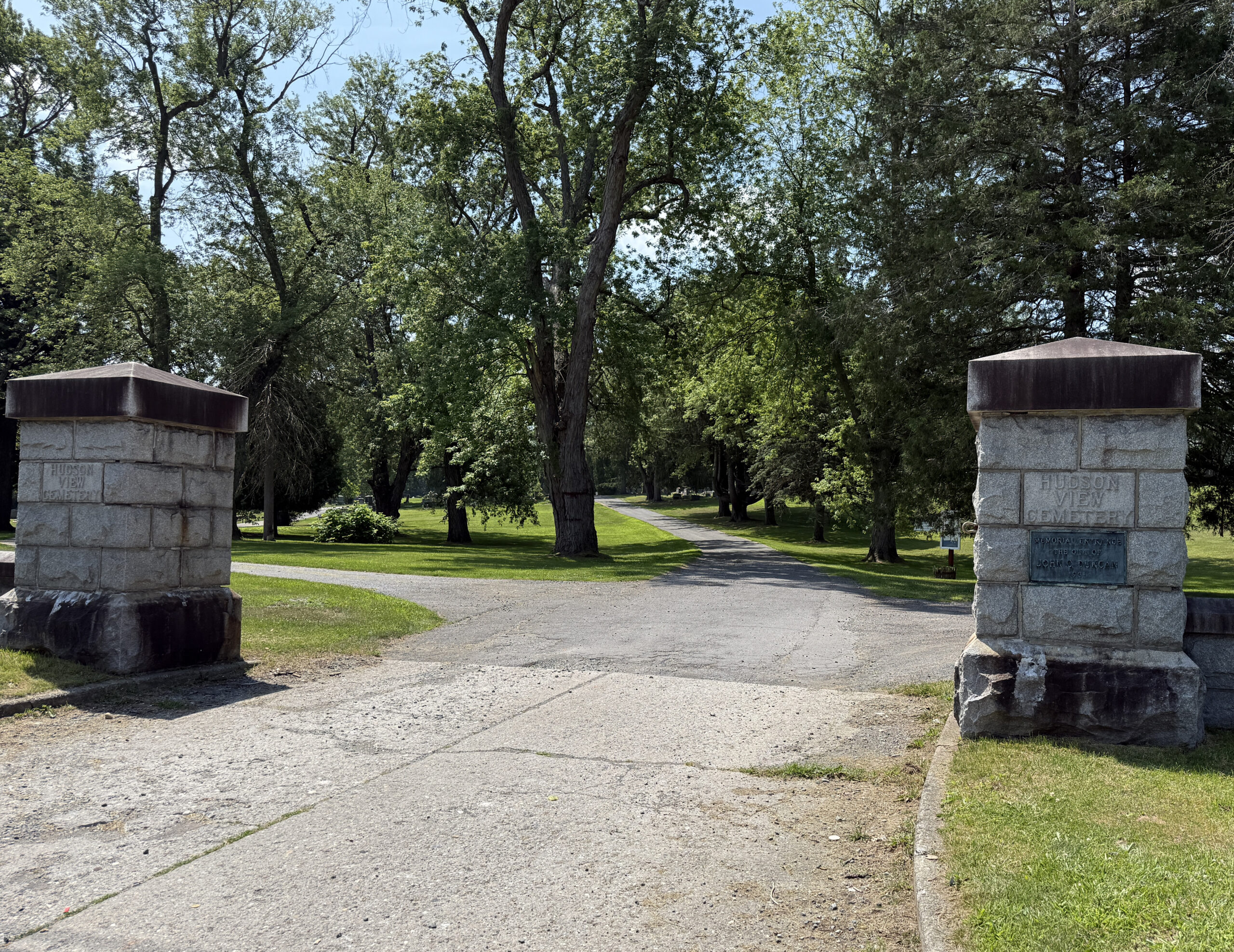Stone entrance pillars and roadway at Hudson View Cemetery in Mechanicville New York