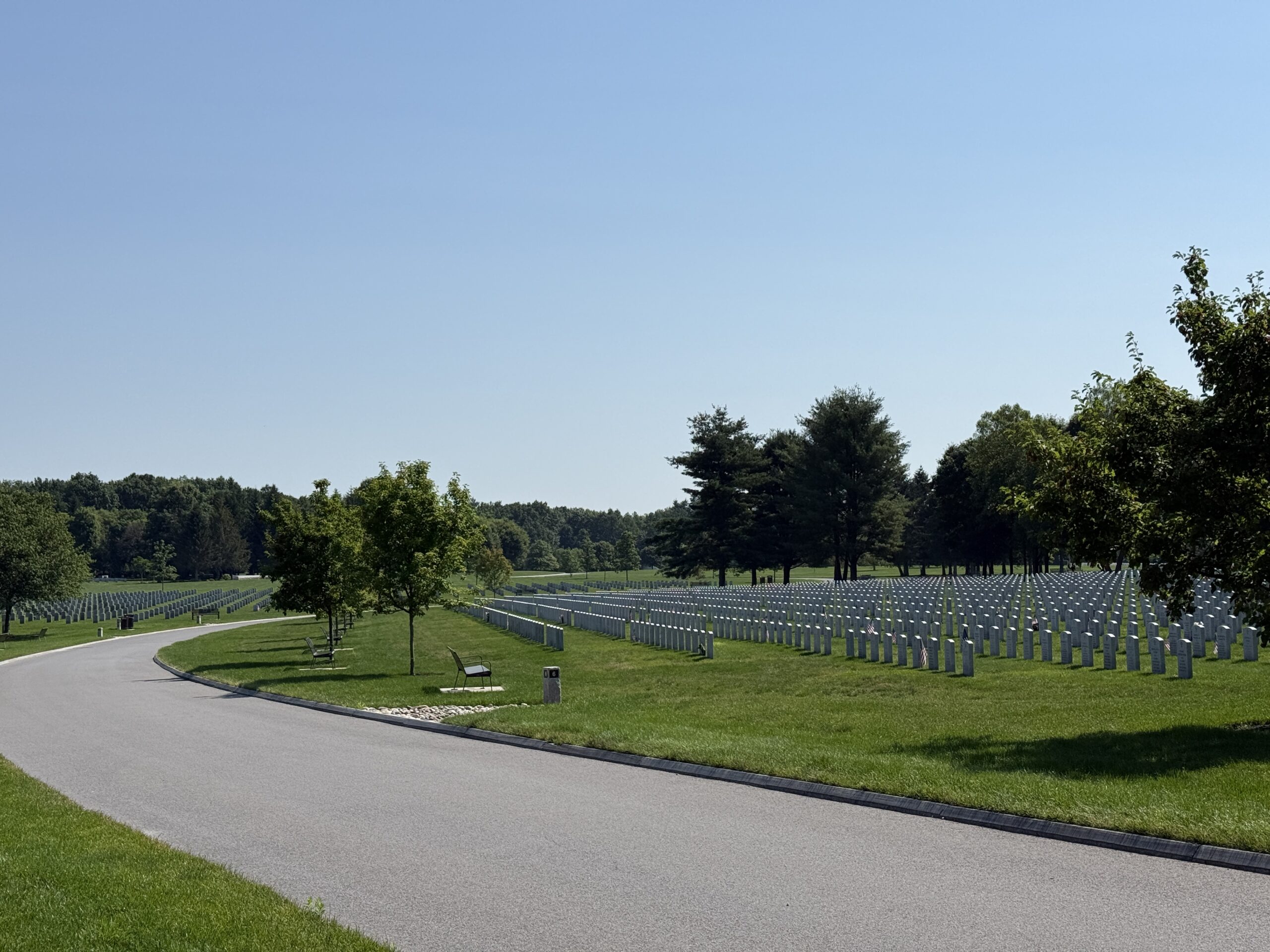 Curving roadway through burial sections at Saratoga National Cemetery in Schuylerville New York