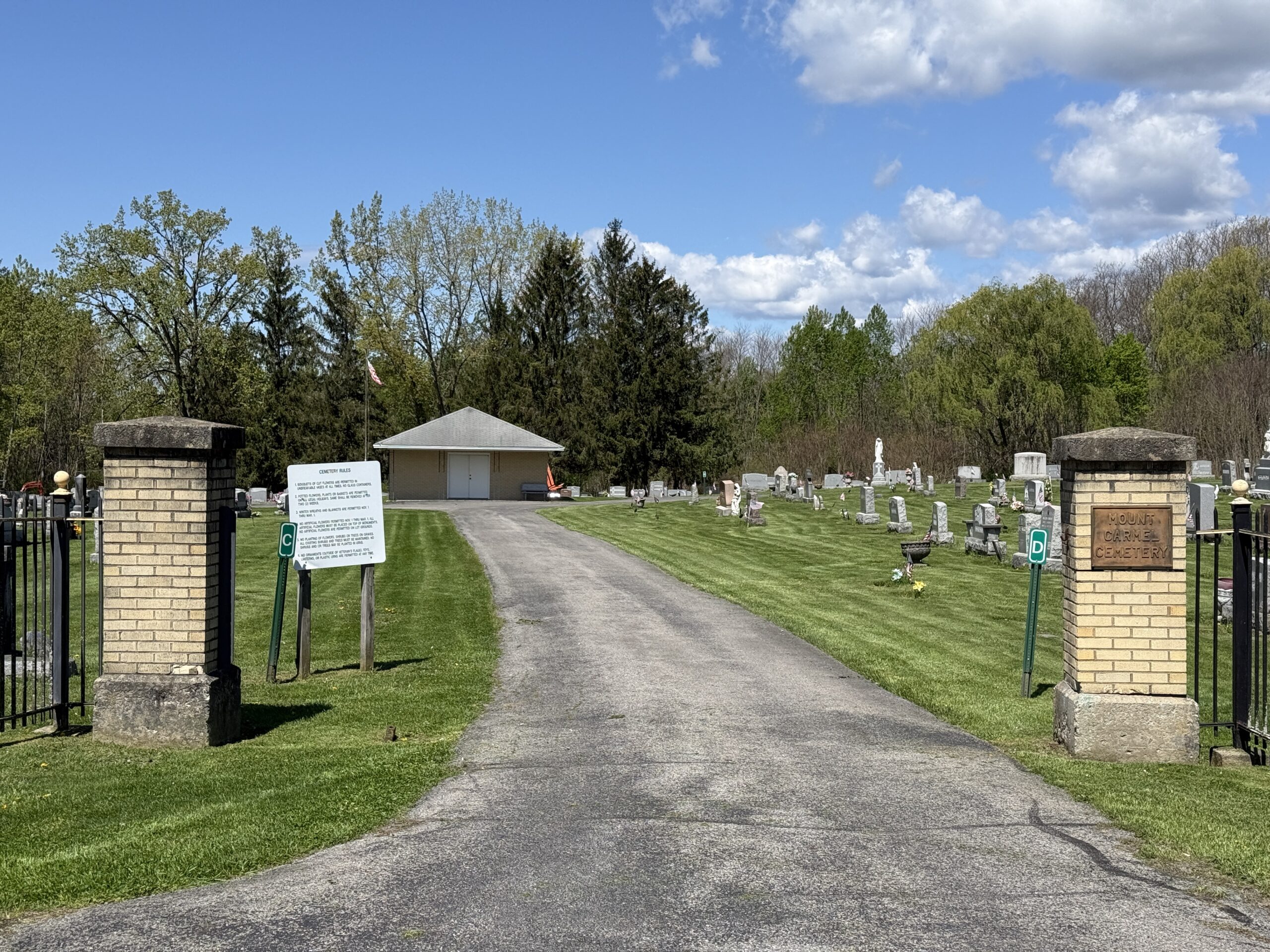 Entrance roadway and memorial landscape at Mount Carmel Cemetery in Amsterdam New York